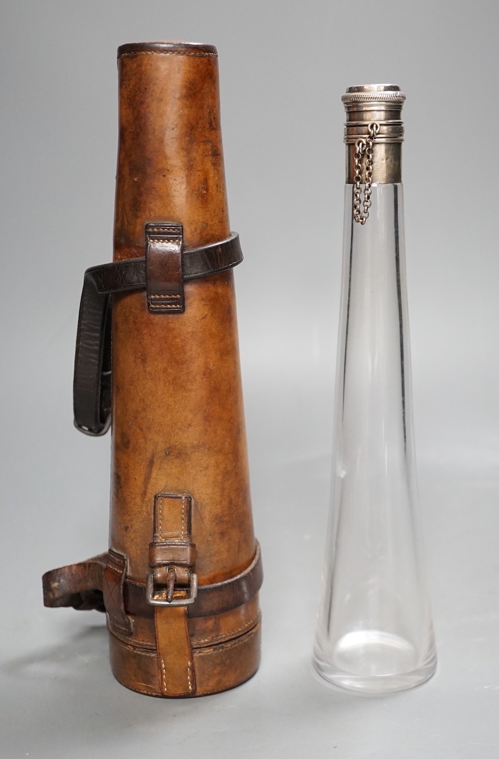 A Victorian silver mounted travelling glass flask in fitted brown leather case,- flask not including case 26.5 cms high.